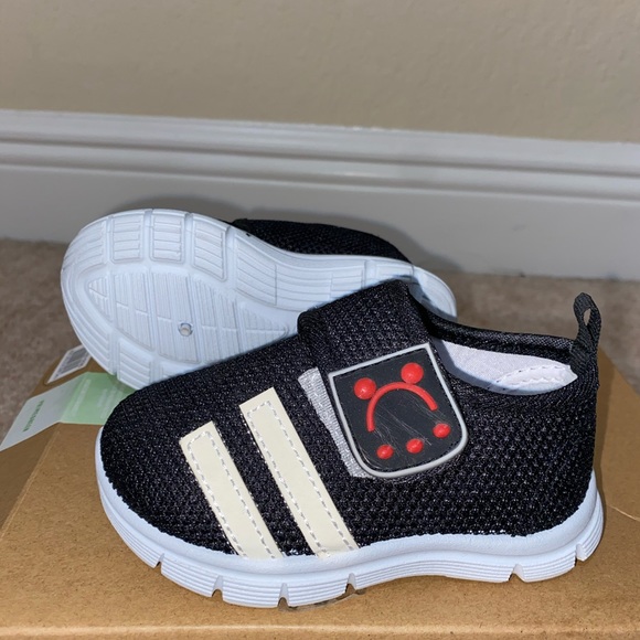 Black pair of strap on Velcro sneakers. - Picture 3 of 3